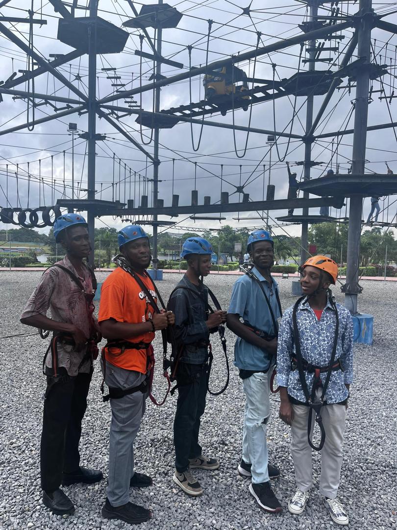 Scholars harnessed and ready for the ropes course
